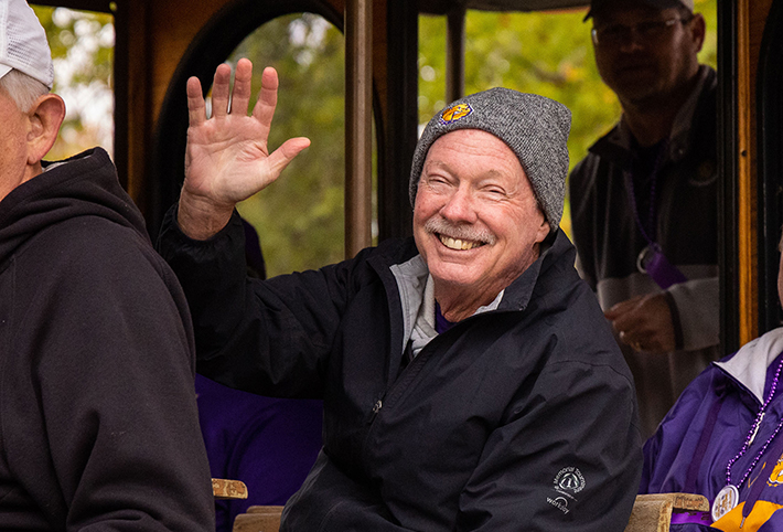 A man smiling and waving. Link to Gifts of Retirement Plans. A man smiling and waving. Link to Gifts of Retirement Plans.