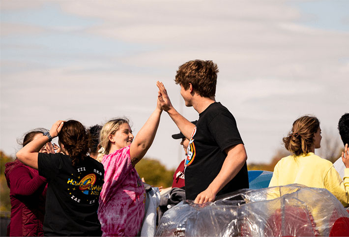 Student high-fiving each other. Links to Donor-Advised Funds Student high-fiving each other. Links to Donor-Advised Funds